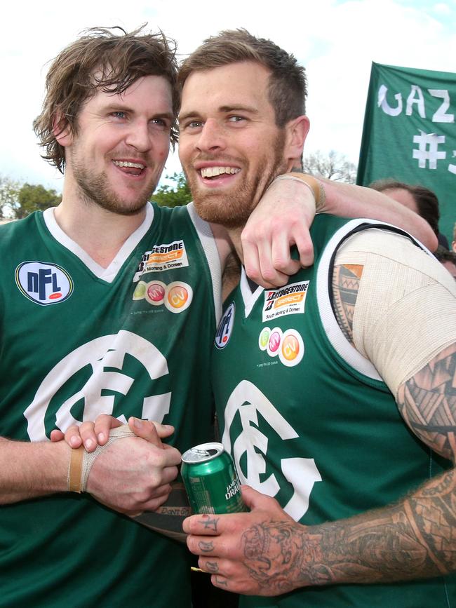 Luke Stanton (right) and Tim Bongetti of Greensborough celebrate a flag in 2014. Picture: Mark Dadswell