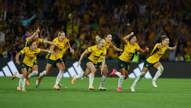 Matildas players celebrate. Picture Lachie Millard