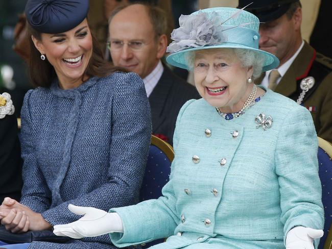 Kate, Duchess of Cambridge,laughs as Queen Elizabeth II gestures while they watch part of a children’s sports event during a visit to Vernon Park in Nottingham, June 13, 2012. Picture: AP