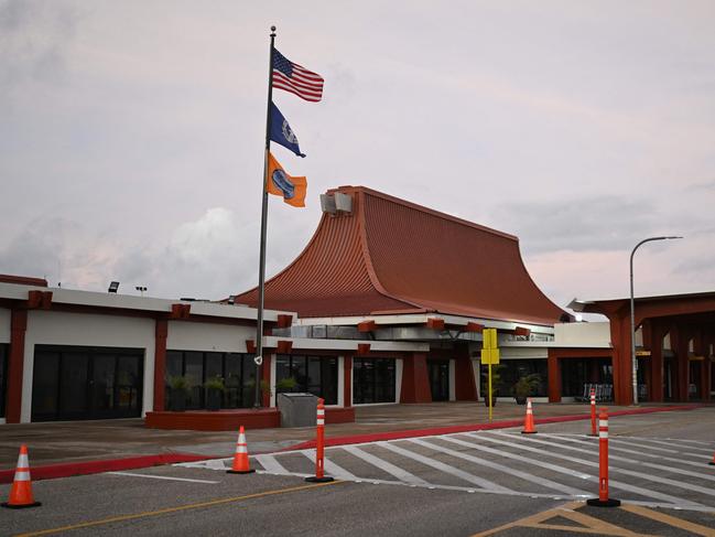 The flag of USA and the flag of the Commonwealth of the Northern Mariana Islands are flown above the Commonwealth Port Authority flag at Saipan International Airport. Photo: AFP.