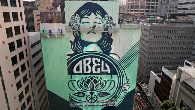 Shepard Fairey’s latest mural is on the side of a building in George St, Sydney. Picture: Toby Zerna