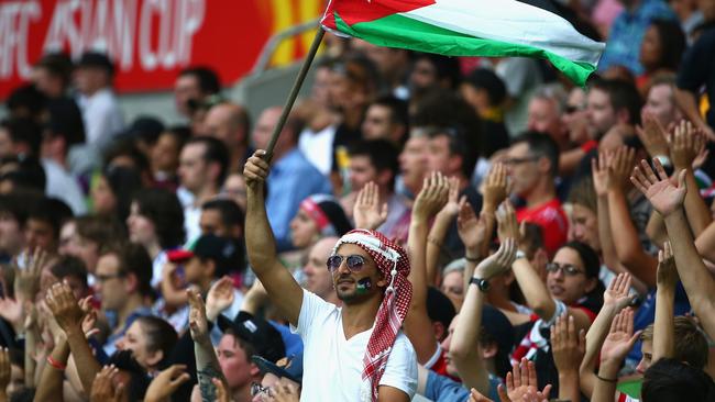 MELBOURNE, AUSTRALIA - JANUARY 16: Fans cheer during the 2015 Asian Cup match between Palestine and Jordan at AAMI Park on January 16, 2015 in Melbourne, Australia. (Photo by Robert Cianflone/Getty Images)