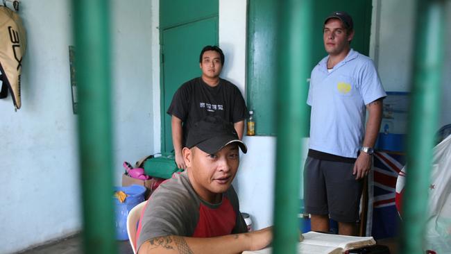 Convicted drug traffickers Si Yi Chan (sitting), Tan Duc Thanh Nguyen (L) and Matthew Norman members of the Bali Nine, in their cell at Kerobokan prison, Bali.