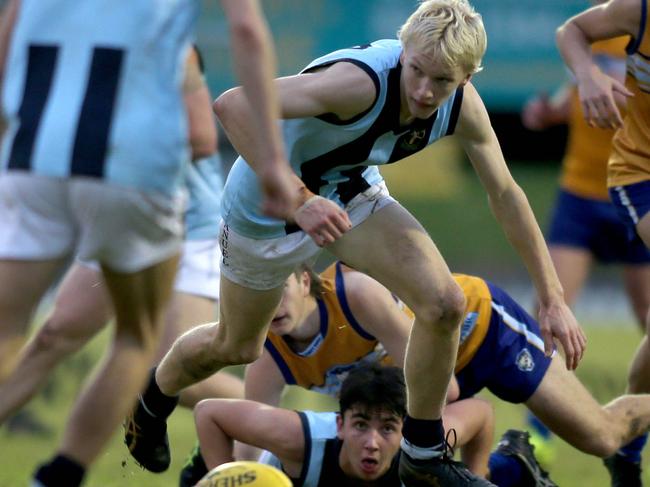 College footy match between Sacred Heart and Immanuel at Glenelg Oval, 19 June 2021. ImmanuelÃs Isaiah Wilksch about to swoop on the ball. Picture Dean Martin