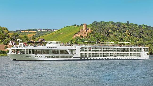 Scenic Tours’ Scenic Diamond river cruise ship in front of Rheinstein Castle on the Rhine River ...