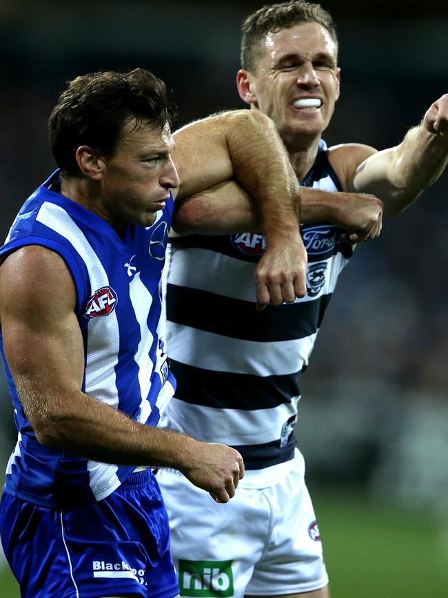 Joel Selwood makes his presence felt to Harvey during a Geelong-North Melbourne game. Picture: Wayne Ludbey AFLR1014
