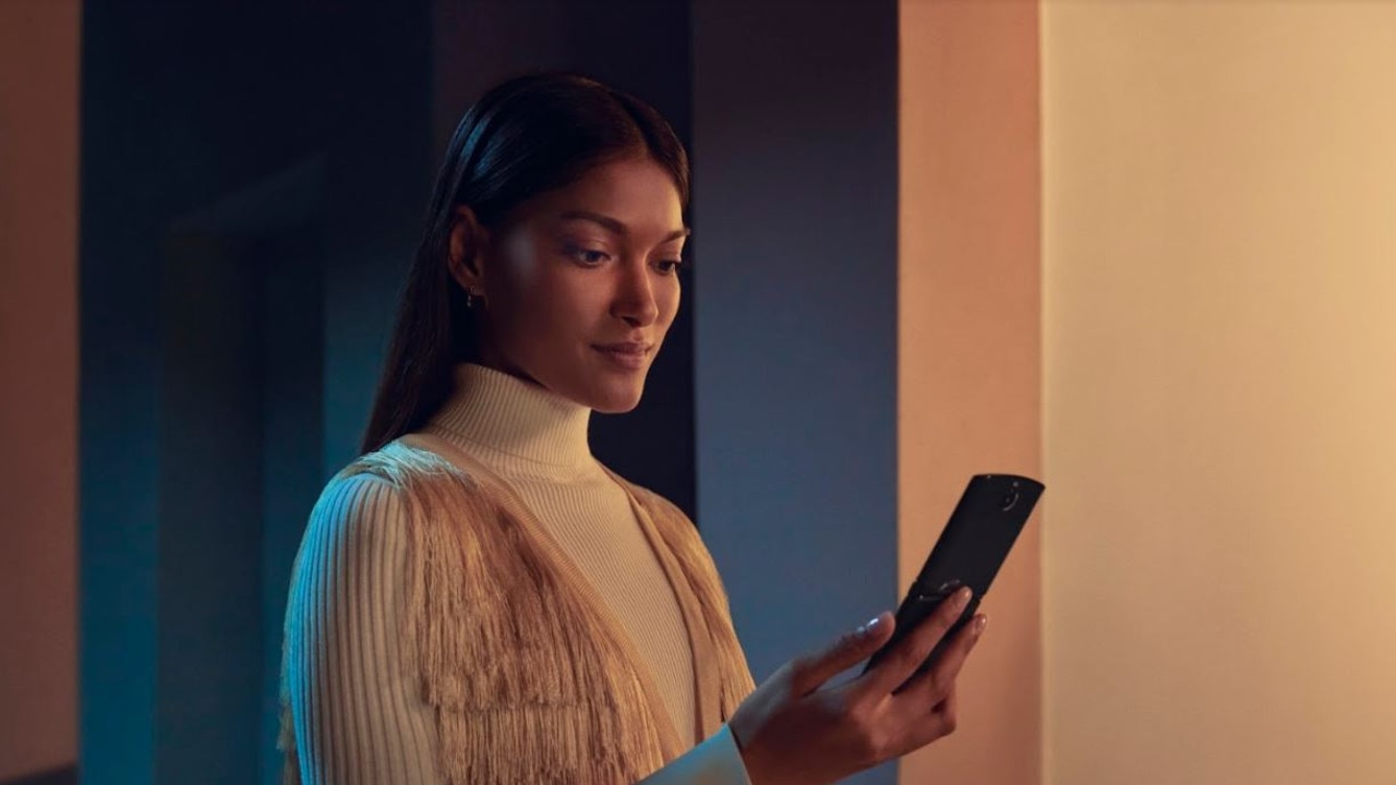 A woman holds the new Motorola Razr foldable smartphone.