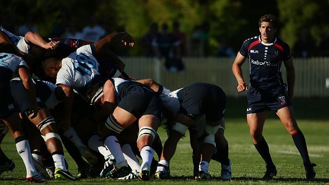 Rebels scrumhalf Luke Burgess awaits the ball to come out of a maul against the Waratahs last week.