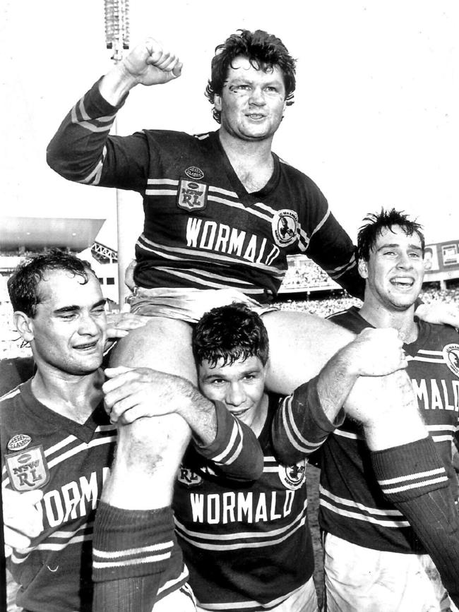 Manly players Dale Shearer, Mal Cochrane and Phil Daley chair captain Paul Vautin after a win over Canberra in the 1987 Grand Final.