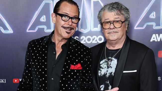 Kirk Pengilly and Tim Farriss are among the current serving members of the legendary Aussie band. Photo by Don Arnold/Getty Images.