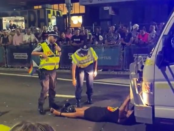 Thorpe in front of the Australian Federal Police float at the Sydney Mardi Gras.