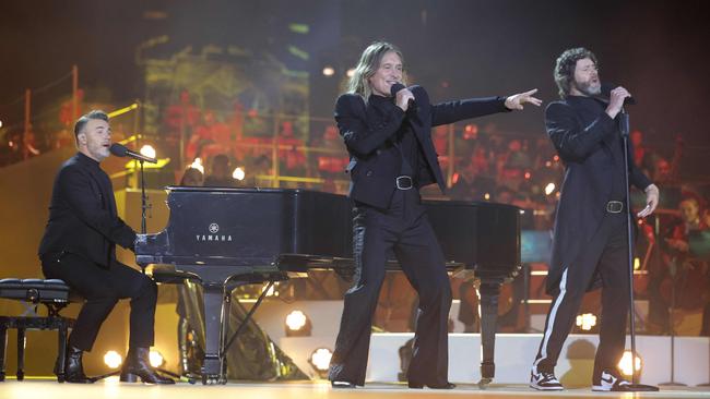 Gary Barlow, Howard Donald and Mark Owen of Take That perform inside Windsor Castle. Picture: AFP