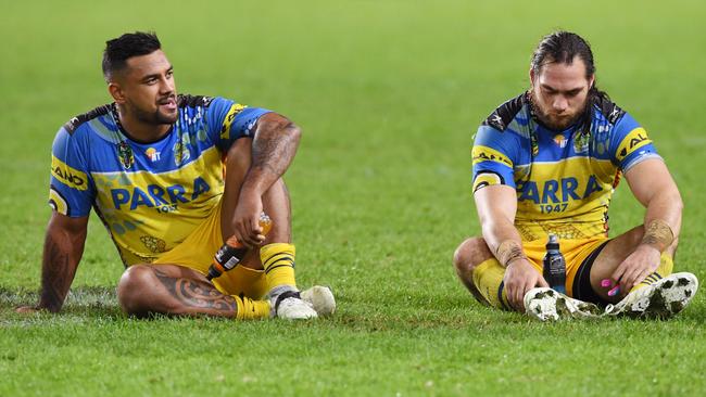 Kenny Edwards (left) and Tepai Moeroa of the Eels sit on the field following the round 10 NRL match between the Sydney Roosters and the Parramatta Eels.