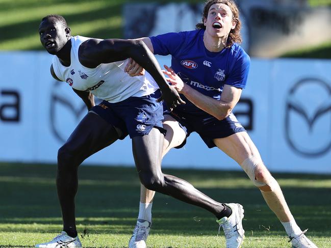 Majak Daw and Ben Brown battle for position at training. Picture: MICHAEL KLEIN