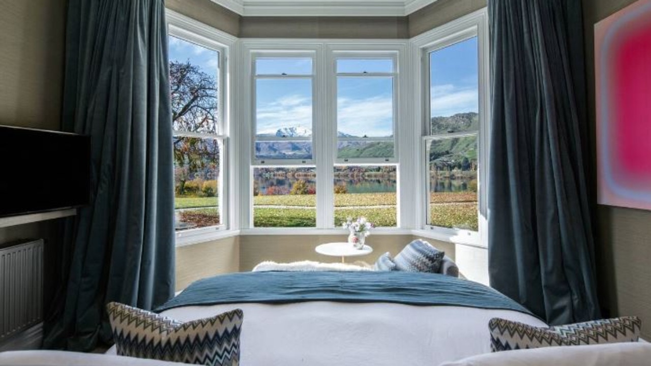 The master bedroom has uninterrupted views of Lake Hayes and beyond.