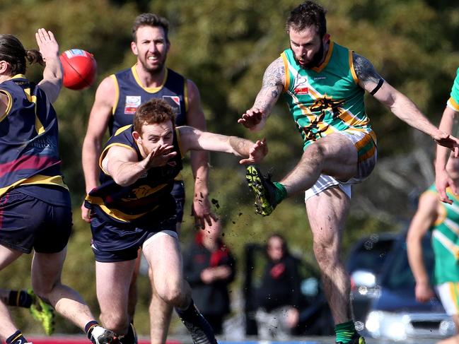 Paul Hagar (R) of Mooroolbark kicks past Nathan Mills of Doncaster East during EFL (Div 2) Doncaster East v Mooroolbark at Tormore Reserve on Saturday, September 9, 2017, in Boronia, Victoria, Australia.Picture: Hamish Blair