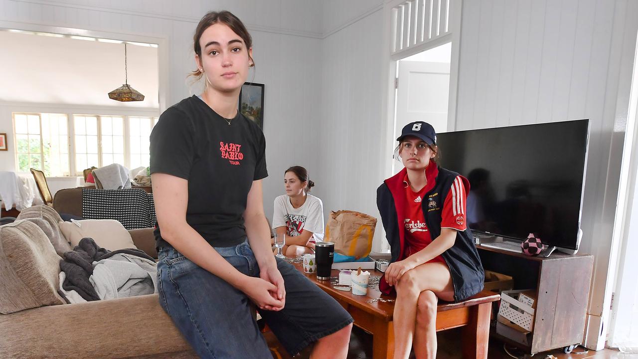 Annabelle Madden, Greta Gutteridge and Aoife O'Sullivan in their home that was flooded last night. Picture, John Gass