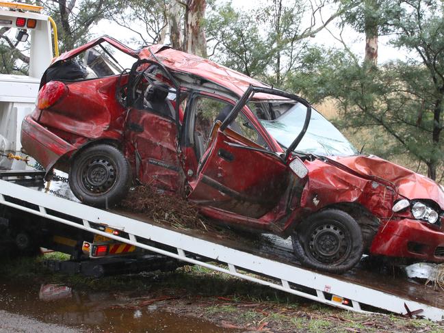 The car is towed from the scene on Sunday. Picture: David Crosling