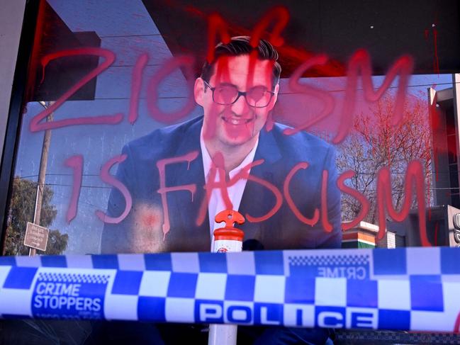 The slogan "Zionism is Fascism" is sprayed on the electoral office of Australian federal Labor Party member of parliament Josh Burns in the Melbourne suburb of St Kilda after police said at least five people smashed windows and painted slogans on the walls on June 19, 2024. It is the latest in a string of acts of vandalism targeting the offices of state and federal MPs in the wake of the conflict in Gaza. (Photo by William WEST / AFP)