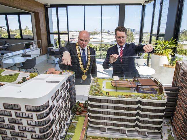 Parramatta Lord Mayor Andrew Wilson and PAYCE director Dominic Sullivan look at a model of Melrose Park onsite.