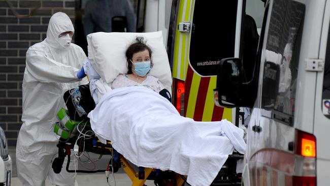 Ambulance staff transport residents from Melbourne’s Epping Gardens Aged Care to hospital. Picture: NCA NewsWire / Andrew Henshaw