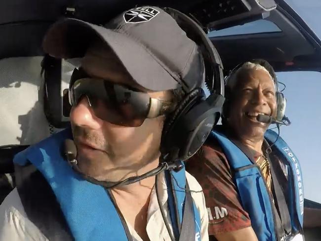 Troy Thomas flying with Ernie Dingo while filming Going Places with Ernie Dingo at Horizontal Falls .