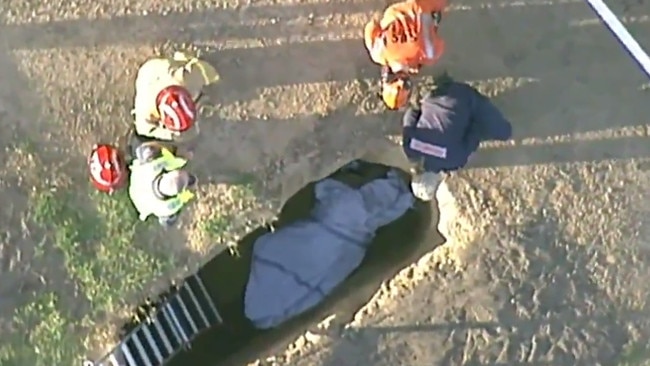 The man is believed to have fallen into the two-metre deep grave early this morning. Picture: ABC