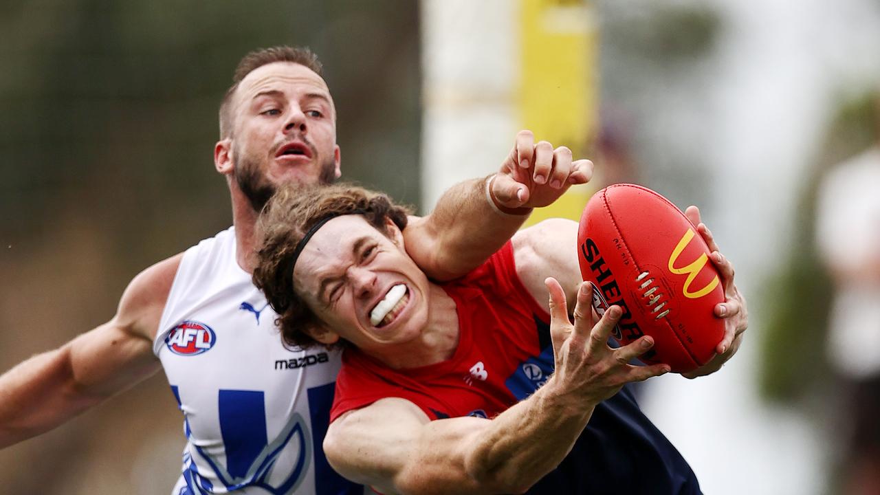 MELBOURNE. 24/02/2022. AFL practise match. Melbourne vs North Melbourne at Casey Fields, Cranbourne. Ben Brown of the Demons marks on the lead infant of Josh Walker of the Kangaroos. Photo by Michael Klein