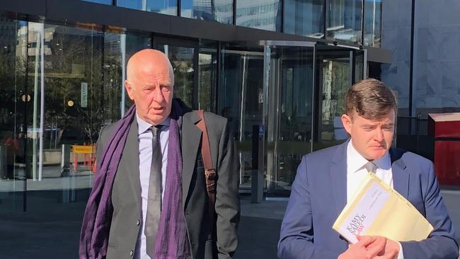 Neil O'Riordan (left) leaving court in July after the ACT DPP dropped a charge against him for assisting the suicide of his wife Penelope Blume.