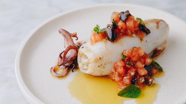 Stuffed calamari with couscous, tomato and black olive salsa is a favourite at Baia Di Vino. Picture: Jake Roden.