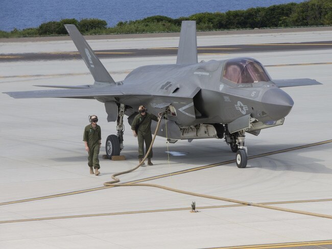 An F-35B Lightning II fighter aircraft with Marine Fighter Attack Squadron 121 being refuelled at a Forward Arming and Refuelling Point during simulated Expeditionary Advanced Base Operations at Ie Shima Training Facility on March 14. Picture: US Marines