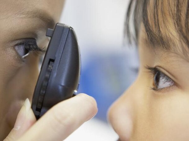 Physician Examining Patient s Eyes