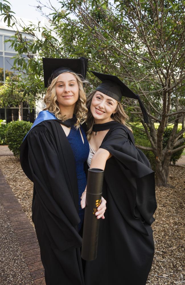 Sienna Deegan (left) and Kassidy Bauer met at placement and graduate together with a Bachelor of Nursing at a UniSQ graduation ceremony at Empire Theatres, Tuesday, October 31, 2023. Picture: Kevin Farmer