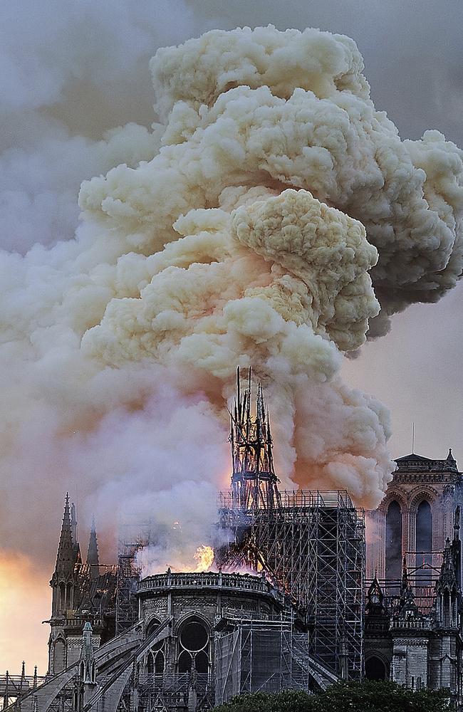 Flames and smoke rise as the spire on Notre Dame cathedral collapses in Paris, Monday, April 15, 2019. (AP Photo/Diana Ayanna)