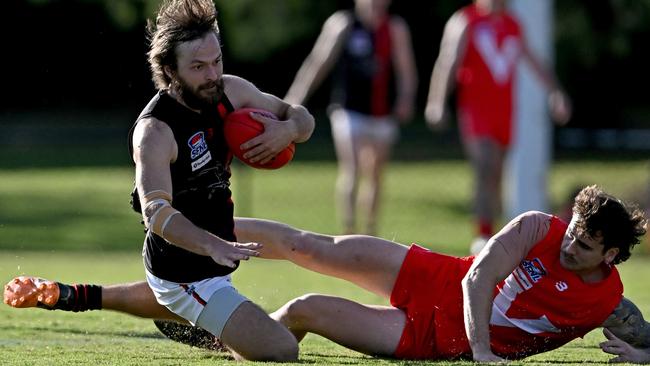 SFNL: Hampton Park’s Joshua Craig marks in front of East Brighton’s Matthew Field. Picture: Andy Brownbill