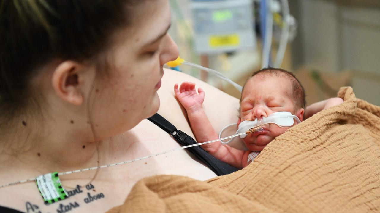 Amy Merrett with her 17-day-old son George at Flinders Medical Centre. Picture: Mark Brake