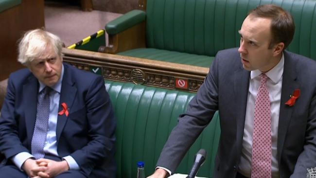 Prime Minister Boris Johnson watches as Health Secretary Matt Hancock closes a debate in parliament last December. Picture: Parliamentary Recording Unit/ AFP