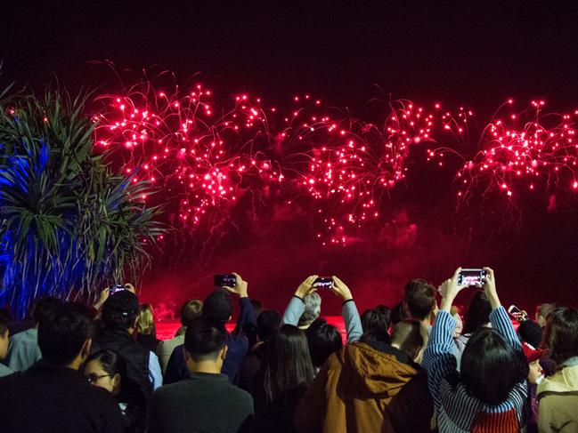 Crowds watch the magnificent display over Surfers Paradise on Saturday night during the annual SeaFire international fireworks competition. Picture: James Wills.