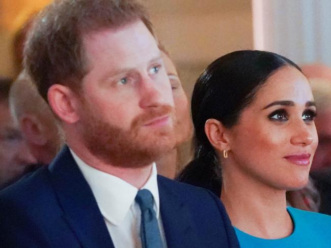 Britain's Prince Harry (1st-L), Duke of Sussex, and Meghan (2nd-R), Duchess of Sussex attend the Endeavour Fund Awards at Mansion House in London on March 5, 2020. - The Endeavour Fund helps servicemen and women have the opportunity to rediscover their self-belief and fighting spirit through physical challenges. (Photo by Paul Edwards / POOL / AFP)