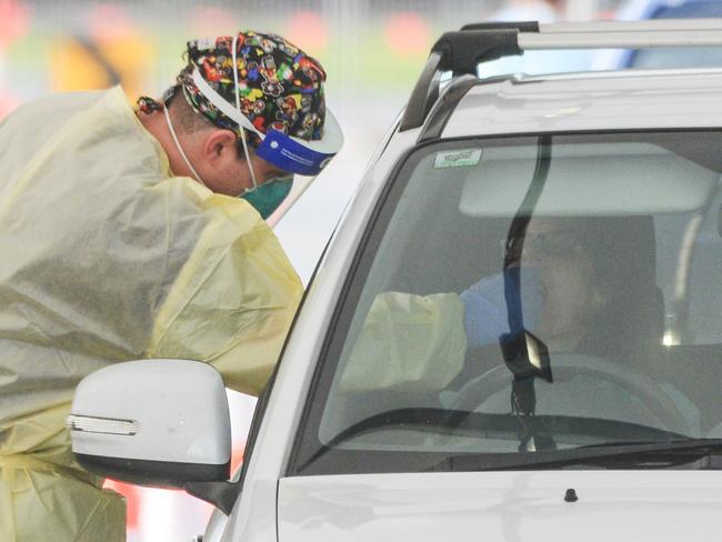 ADELAIDE, AUSTRALIA - NewsWire Photos JULY 01, 2021 -  Lines of cars and health workers at the Victoria Park Covid testing clinic in Adelaide. Picture: NCA NewsWire / Brenton Edwards