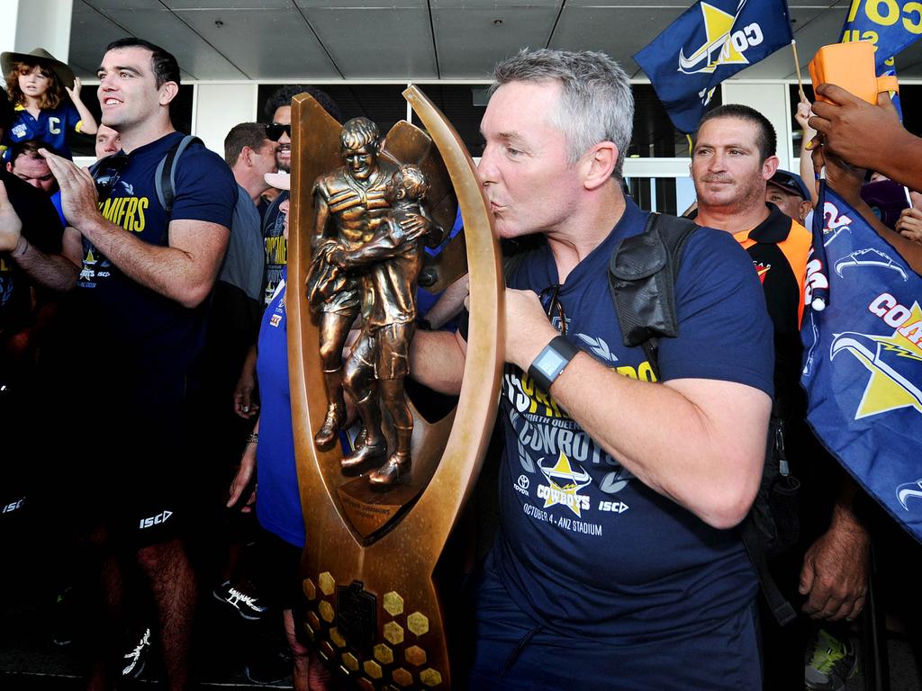 The North Queensland Cowboys return to Townsville after their grand final win in Sydney Coach Paul Green kisses the trophy