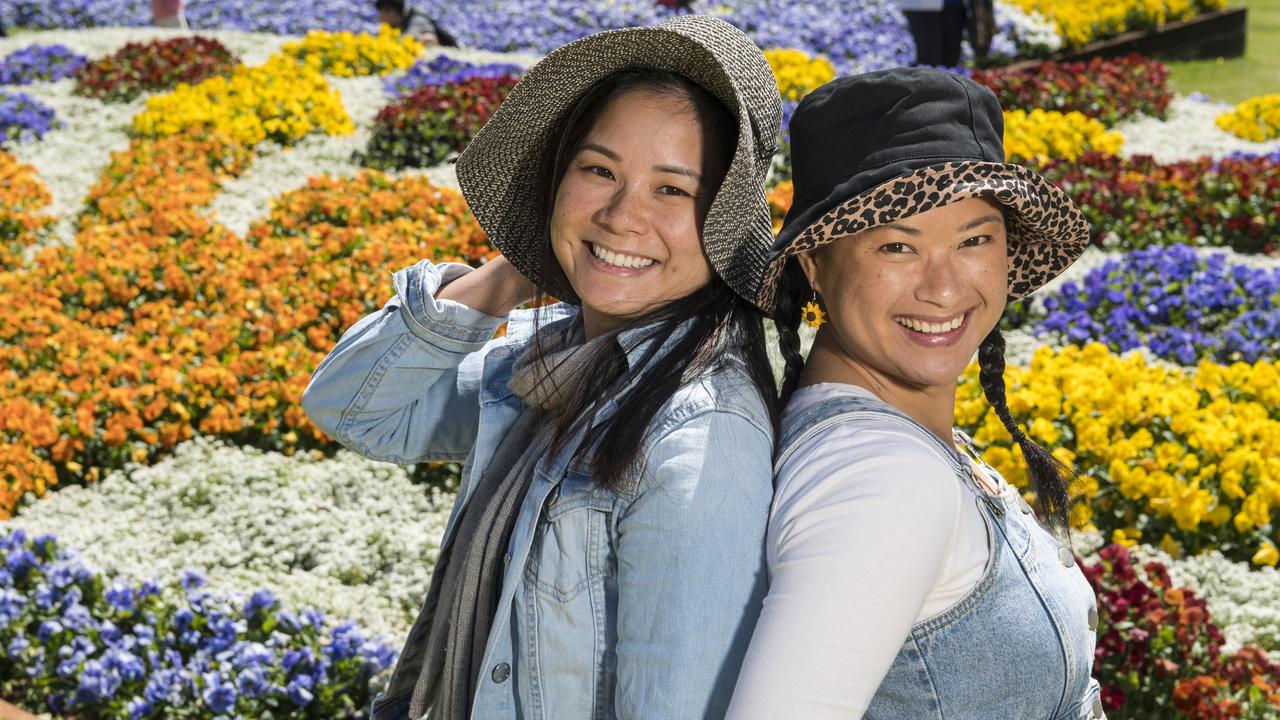 Sisters Kim Huynh (left) and Lyn Ha in Laurel Bank Park during Carnival of Flowers 2020. Picture: Kevin Farmer