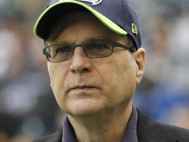 FILE - In this Oct. 14, 2012 file photo, Seattle Seahawks owner Paul Allen appears on the field prior to an NFL football game against the New England Patriots in Seattle. Allen, billionaire owner of the Trail Blazers and the Seattle Seahawks and Microsoft co-founder, died Monday, Oct. 15, 2018 at age 65. Earlier this month Allen said the cancer he was treated for in 2009, non-Hodgkinâ€™s lymphoma, had returned.   (AP Photo/Elaine Thompson, File)