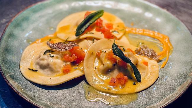 Hand made salmon and zucchini ravioli with butter and sage sauce served on a pumpkin puree at Il Chiosco at Trinity Beach. Picture: Supplied