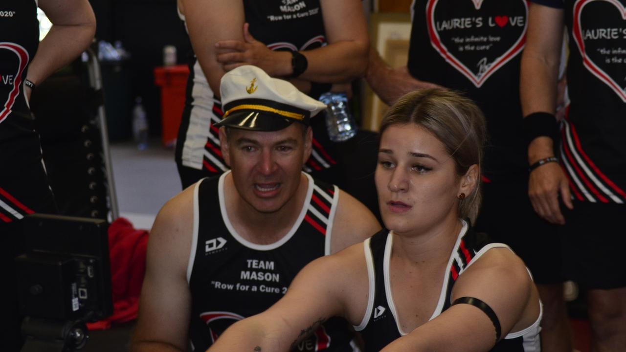 Team Mason rower Emma Lawson completed her stint on the rower with (left) Wayne DiBartolo cheering her on. in the 2020 Laurie's Love Row for a Cure.