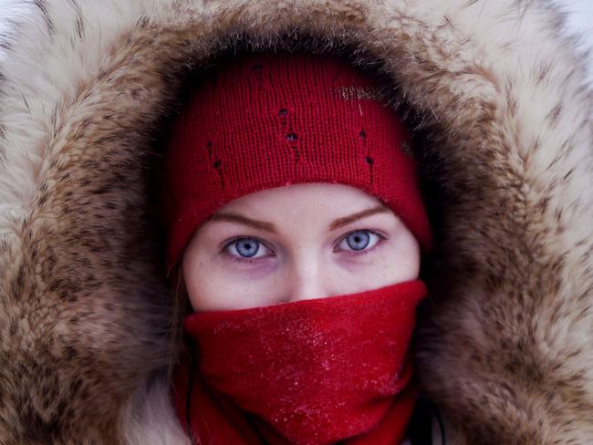 ONE TIME WEB USE ONLY - Credit: Amos Chapple/REX/Shutterstock/Australscope Mandatory Credit: Photo by Amos Chapple/REX/Shutterstock (2087439h) A young student poses for a portrait at a bus station in Yakutsk Village of Oymyakon, which is considered to be the coldest permanently inhabited settlement in the world, Russia - Jan 2013 *Full story: http://www.rexfeatures.com/nanolink/jpod If you thought it was cold where you are at the moment then a visit to the Russian village of Oymyakon and city of Yatutsk might just change your mind. With the average temperature for January a blisteringly cold -50c it is no wonder Oymyakon is the coldest permanently inhabited settlement in the world. Oymyakon lies a two day drive from the city of Yakutsk, the regional capital, which has the coldest winter temperatures for any city in the world. Ironically, Oymyakon actually means "non-freezing water" due to a nearby hot spring. The village was originally a stopover for reindeer herders who would water their flocks from the thermal spring. Known as the "Pole of Cold", the coldest ever temperature recorded in Oymyakon was a mind numbing -71.2c. This is the lowest recorded temperature for any permanently inhabited location on Earth and the lowest temperature recorded in the Northern Hemisphere.