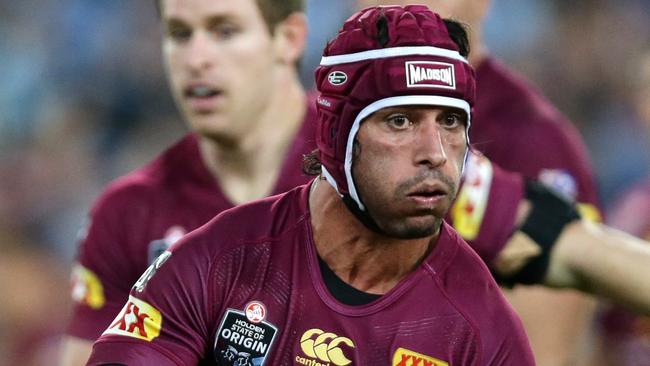 QLD's Johnathan Thurston passes during Game 1 of the 2015 State of Origin series between the NSW Blues and the Queensland Maroons at ANZ Stadium,Homebush .Picture Gregg Porteous