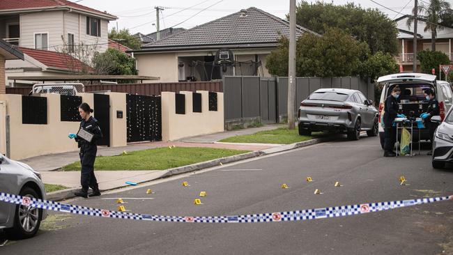 Forensic officers comb Crossland St in Merrylands following an alleged shooting. Three cars were allegedly torched in the nearby suburb of South Granville shortly after. Picture: NewsWire/ Julian Andrews