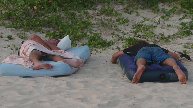 New Year’s Day at Mooloolaba Sleeping off the night before in 2006. Picture: Warren Lynam