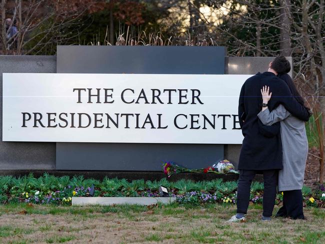 Visitors leave floral tributes at The Carter Presidential Centre in Atlanta, Georgia. Picture: Getty Images via AFP